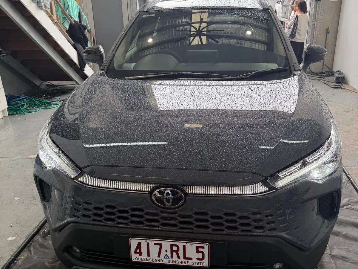Ceramic coated Toyota Corolla Cross with water beading across the bonnet, Brisbane