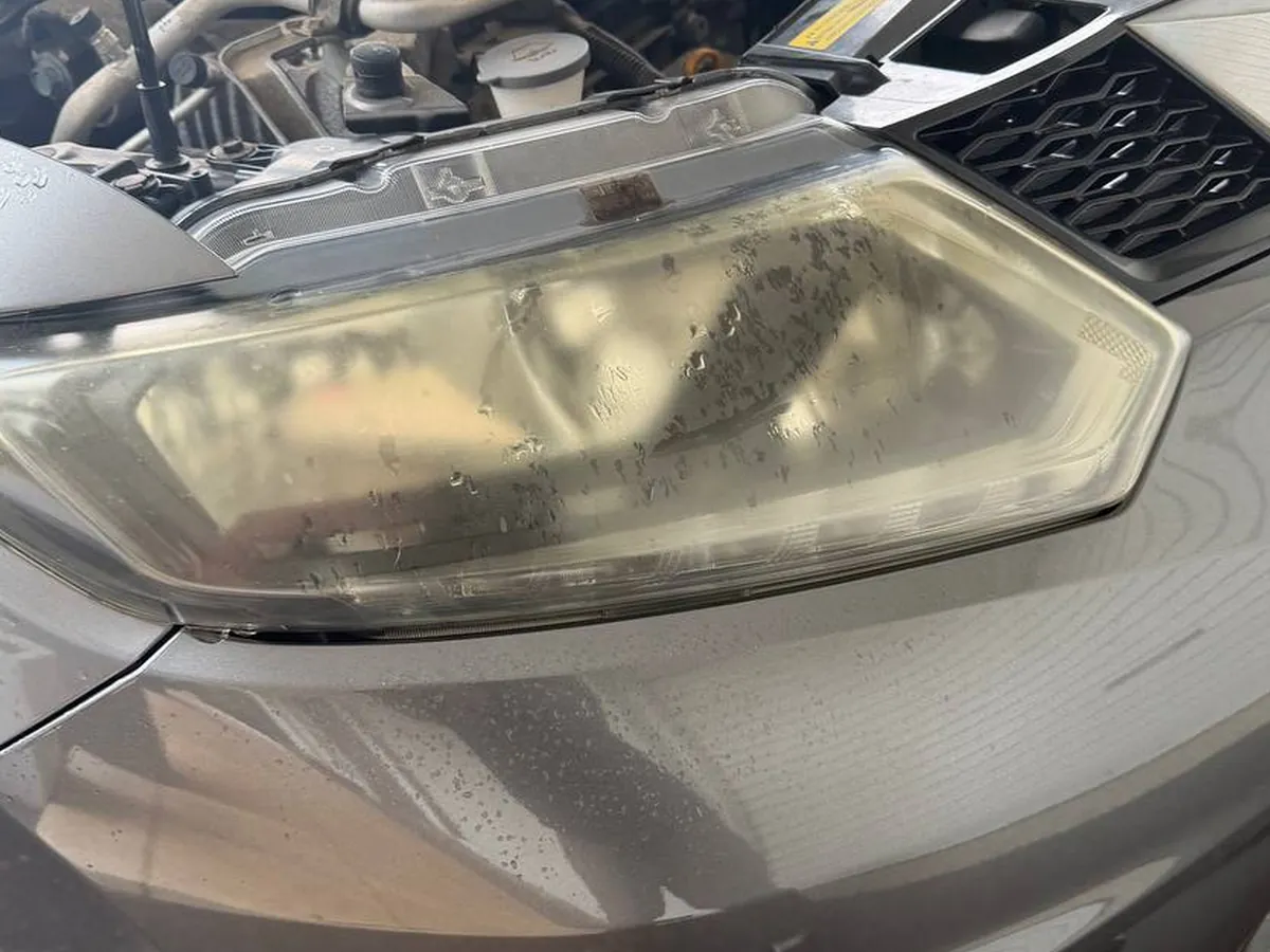 Close up of the oxidised yellow layer on a headlight lens