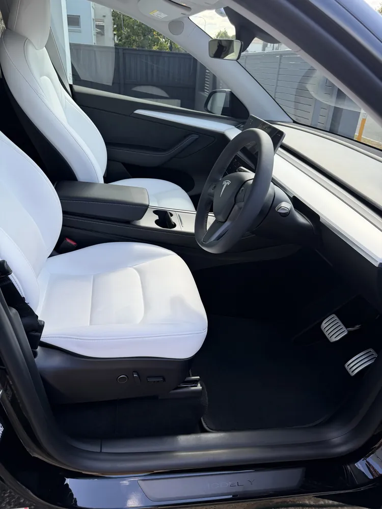 Tesla Model Y, white seats, detailed in Brisbane